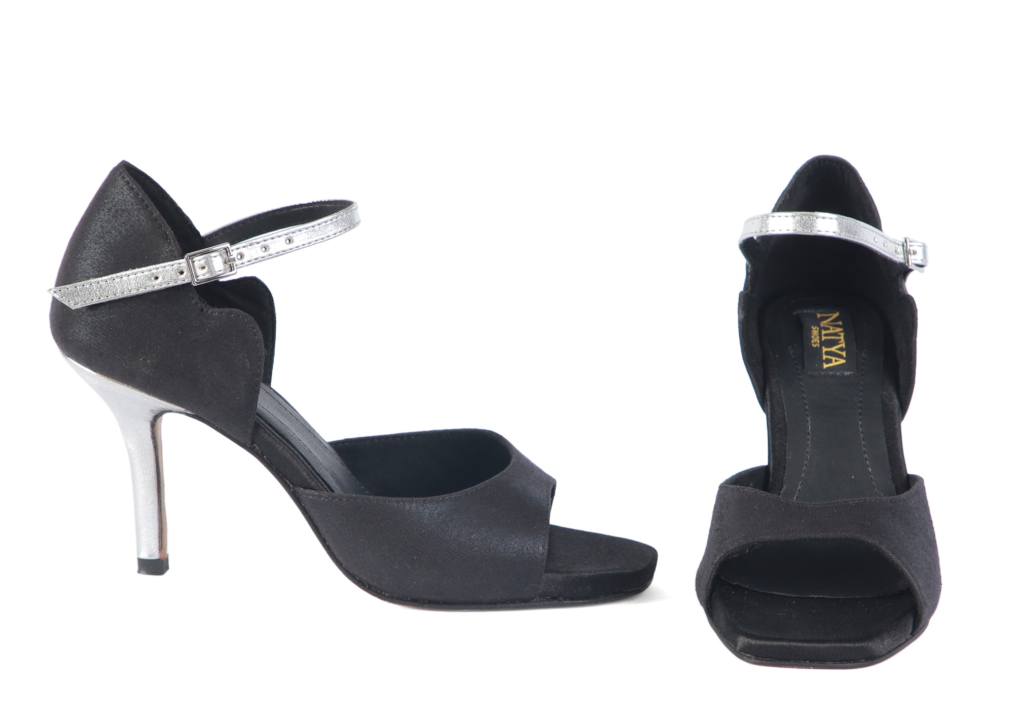 Black high-heeled shoes with silver straps on a white background