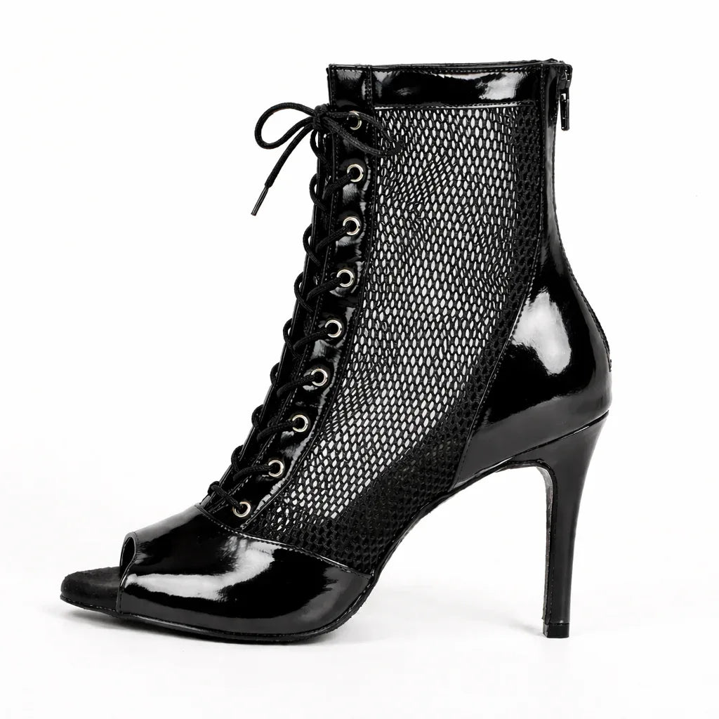 Black high-heeled shoe with mesh design on a white background